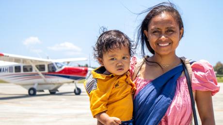 A woman and small boy with a plane
