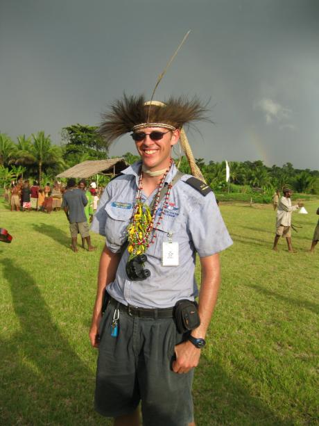 MAF pilot in cultural head dress ijn village
