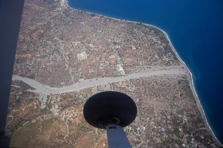 An aerial view of a beach and residential area