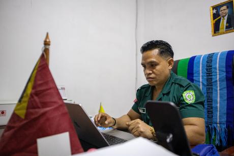 A man works in his office at his desk